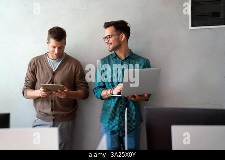 Programmers working in a software developing company office Stock Photo