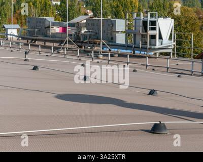 Lightning rod system in the background chiller fan coil system installed on the roof of a building Stock Photo