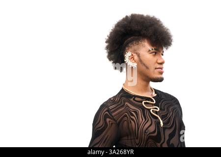 Stylish androgynous person with afro hair and unique accessories exudes confidence in a fashion forward portrait Stock Photo