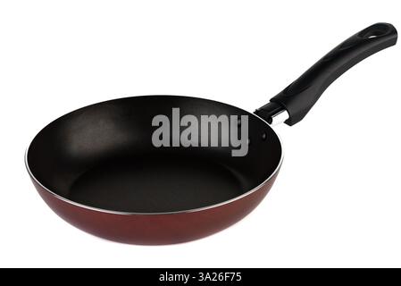 The new non-stick frying pan with a durable black handle, set against a clean white background, showcases its contemporary design. Stock Photo