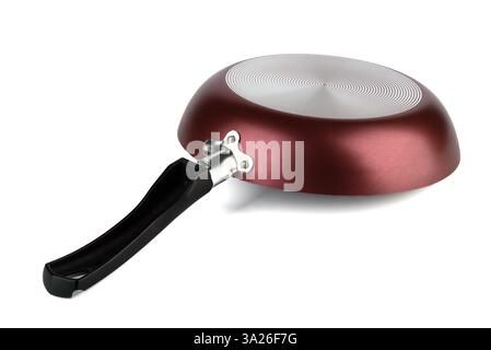 A frying pan with a black handle and a spiral pattern on the bottom, displayed on a white background, showcasing its modern design. Stock Photo