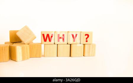 Why question symbol. Concept word Why question on beautiful wooden blocks. Beautiful white table white background. Business, lifestyle, support and wh Stock Photo