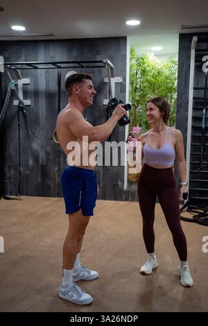 Couple drinking water after gym. High quality photo Stock Photo