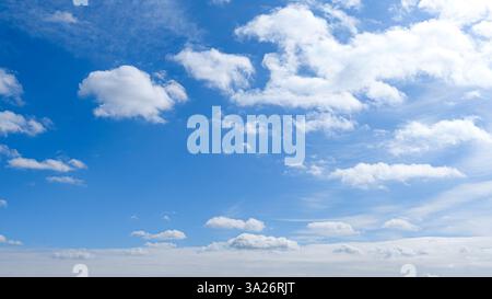 Soft white clouds in a blue morning sky Stock Photo