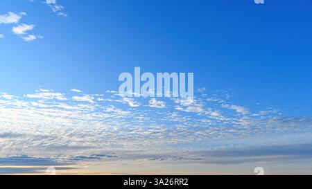 Small clouds in a soft morning sky Stock Photo