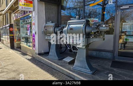 Two movie projectors of 1968 release of the German manufacturer Bauer, located on the street, near the cinema. Best and long-lasting film projectors w Stock Photo