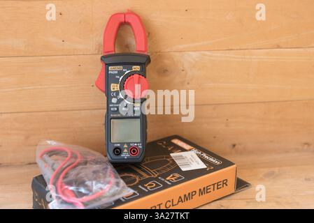 Nakhonpathom,Thailand - 28 Feb, 2025: Closeup to Aneng PN200 clamp meter for clamp meter on wood plate Stock Photo