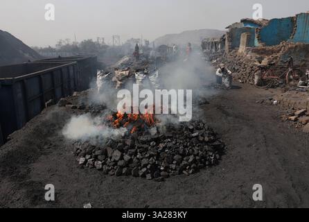 Coal mines of Jharkhand, India Coal scavengers L, fill and arrange ...