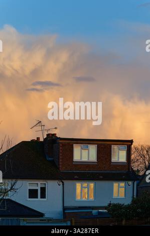 Dramatic winter storm clouds forming over rooftops in a residential area Shepperton Surrey England UK Stock Photo