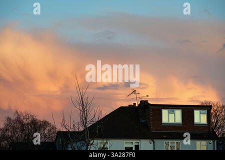 Dramatic winter storm clouds forming over rooftops in a residential area Shepperton Surrey England UK Stock Photo