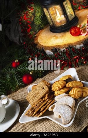 Different types of biscuits with rustic Christmas decorations Stock Photo