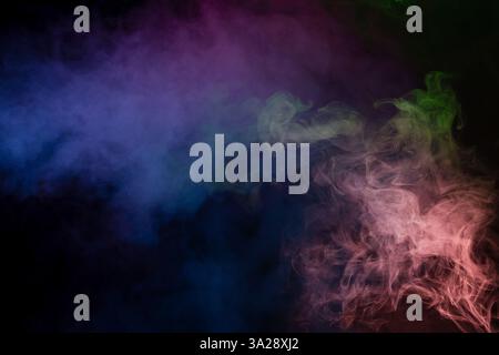 Blue and purple steam on a black background. Copy space. Stock Photo