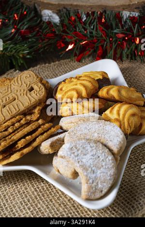 Different types of biscuits with rustic Christmas decorations Stock Photo