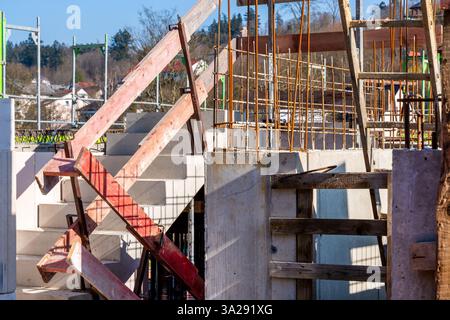 Construction site of a new building with concrete and reinforcement. Construction site with formwork, concrete, and reinforcement Stock Photo