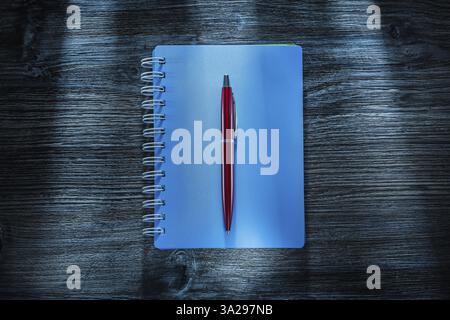 Set of notebooks pen on vintage wooden board Stock Photo