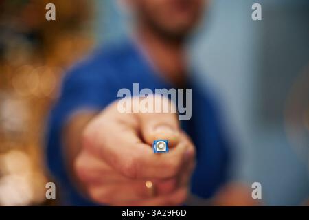 Close up view of man hand that is holding internet cable. Stock Photo