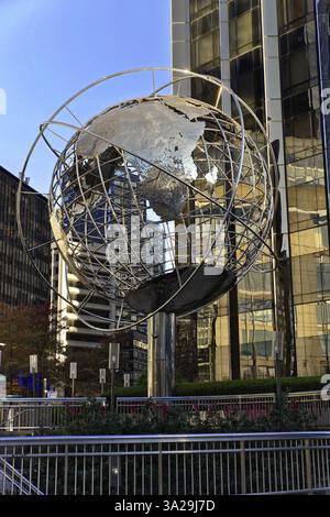 Manhattan, New York, USA, United States of America, North America, Metal globe sculpture in front of skyscraper facades in the city centre, North Amer Stock Photo