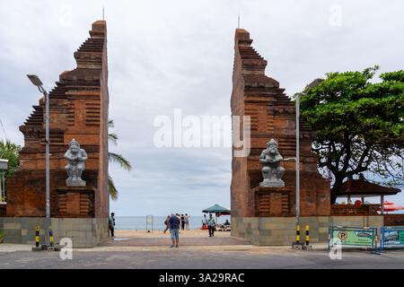 A Candi Bentar or Balinese split gate leading to Kuta beach in Bali, Indonesia. Stock Photo