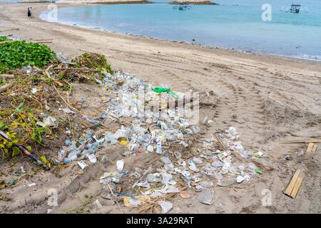 Bali, Indonesia - January 5, 2025: The tide of plastic (Marine litter) on the beach. Stock Photo