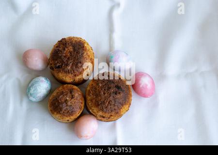 three whole wheat Easter cakes and Easter eggs, top view Stock Photo