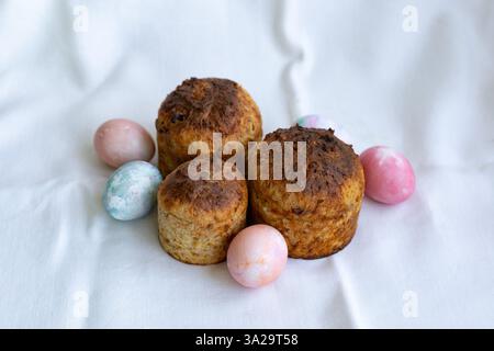 three whole wheat Easter cakes and Easter eggs Stock Photo