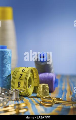 Sewing items on blue background Stock Photo