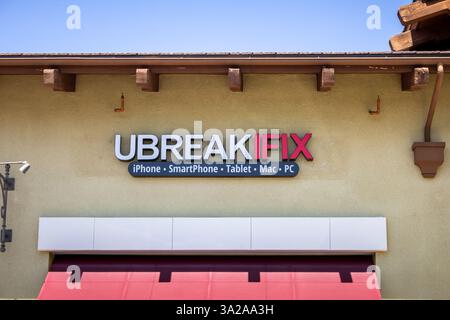Lake Forest, California, United States- 04-22-2019: A view of a store front sign for the technology repair center chain known as uBreakiFix. Stock Photo