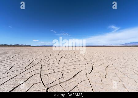 Death Valley area dry lake with cracked earth in California's Mojave desert. Stock Photo