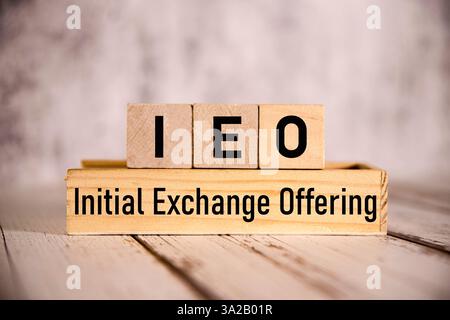 There is sticky note with the word Initial Exchange Offering. It is as an eye-catching image. Stock Photo