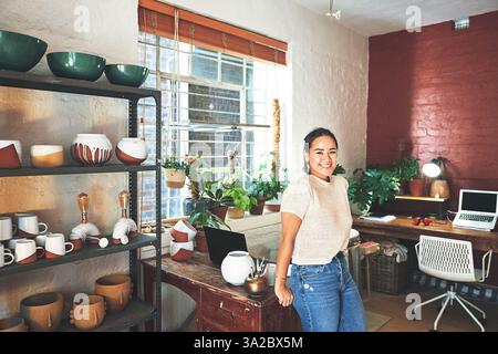 Pottery, workshop and woman with smile in portrait for manufacturing startup, creative studio or pride. Small business, happy owner or professional Stock Photo