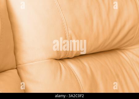 Brown leather texture. Part of perforated leather details. Orange perforated leather texture background. Texture, artificial leather with diagonal sti Stock Photo