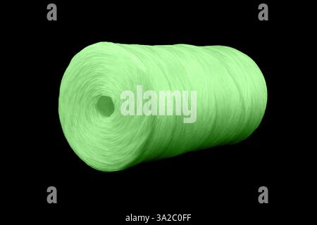 Coiled nylon rope isolated on white background. Green rolled  striped nylon rope isolated. A coil of new colored rope. Stock Photo