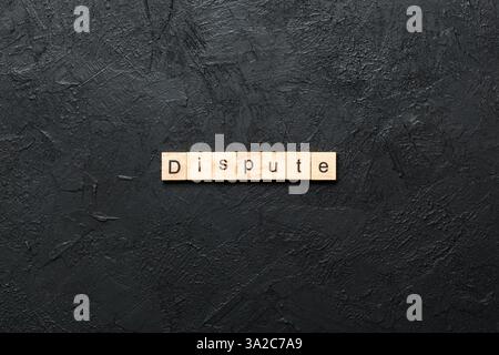 dispute word written on wood block. dispute text on table, concept. Stock Photo