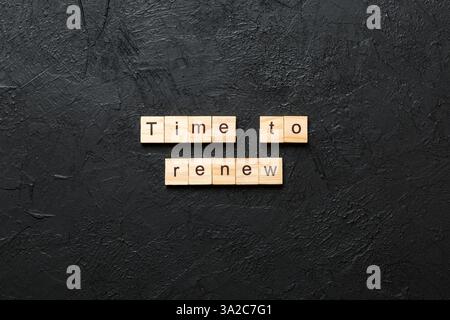 time to renew word written on wood block. time to renew text on table, concept. Stock Photo