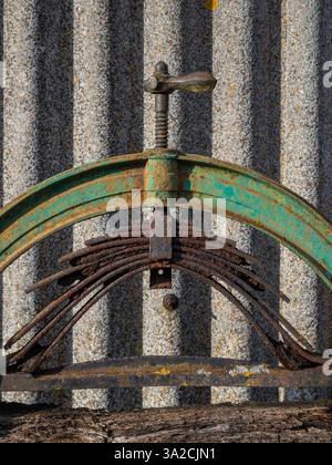 Close up of the screw mechanism on an old rusty mangle, Upper Stowe Dairy Farm, Northamptonshire, UK Stock Photo