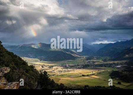 Rainbow over mountains and the valley Stock Photo