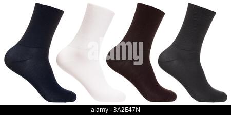 A set of four relaxed top crew socks in navy blue, white, brown, and dark gray on foot mannequin isolated on a white background Stock Photo