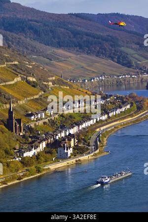 Elevated view over the Rhine from Bacharach and Lorch with the parish church of St. Martin, with barge and helicopter, UNESCO World Heritage Upper Mid Stock Photo