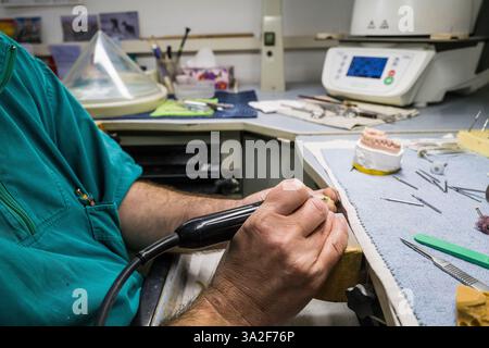 Dentist working on dental cast , Curno, Italy. Stock Photo
