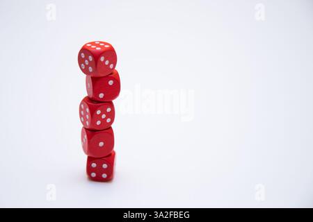 close up of red dice piled up on white background Stock Photo
