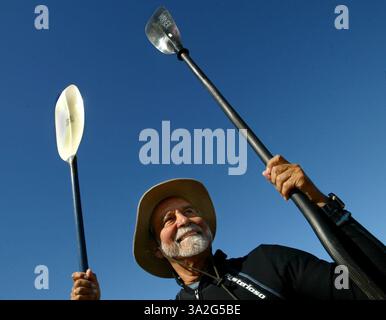 Carlos De la Fuente 66, holds a couple of kayak paddles on the shore of Folsom lake where he prepares for an early morning training session. Carlos De la Fuente 66, a retired criminal defense attorney and peace activist, will set out on an amazing journey next month, kayaking 25,000 miles from Santa Barbara to Costa Rica in an effort to bring attention to ''promote world peace'' and bring attention to his concerns about environmental degradation, particularly in his beloved Sea of Cortz. (Credit: © Sacramento Bee/ZUMAPRESS.com) Stock Photo