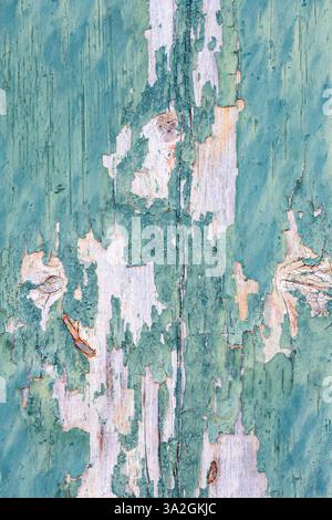 Old cracked weathered wooden shutters blue, old blue paint is peeling off. background Stock Photo