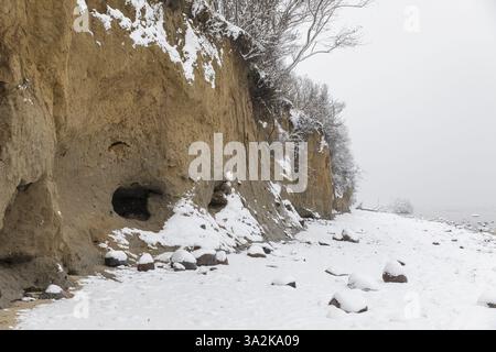 Calm Baltic Sea and snow on the beach, Am Schwarzen bush cliffs, Poel Island, Mecklenburg-Western Pomerania, Germany, Europe Stock Photo