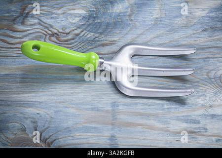 Trowel fork on wooden board horizontal view gardening concept Stock Photo