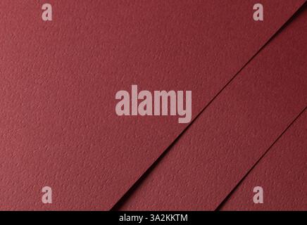 Deep burgundy paper background with a matte texture and fine, tactile surface. Warm red tones create an elegant, luxurious, and minimalistic design, w Stock Photo