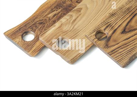 Very close up view three oak wood serving boards isolated on white Stock Photo