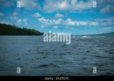 crocodile island with Dark blue waters under a sky filled with thick, fluffy clouds in boracay Stock Photo
