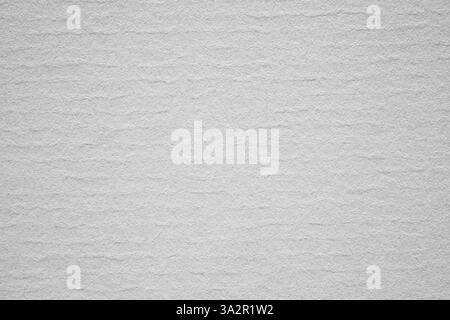 Macro detail texture of a white paper with horizontal wave-like ripples in soft light, perfect for backgrounds and graphic design. Stock Photo