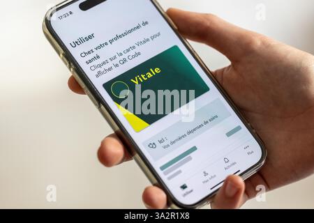 Paris,  France - March 13, 2025 : Vitale card. The Vitale card is accessible from the insured's smartphone using the Vitale card app Stock Photo