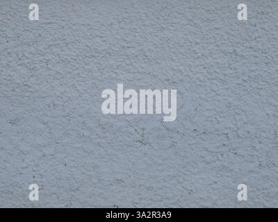 plastered wall surface with frozen textured streaks and dust in texture folds, abstract light gray background with lip relief Stock Photo